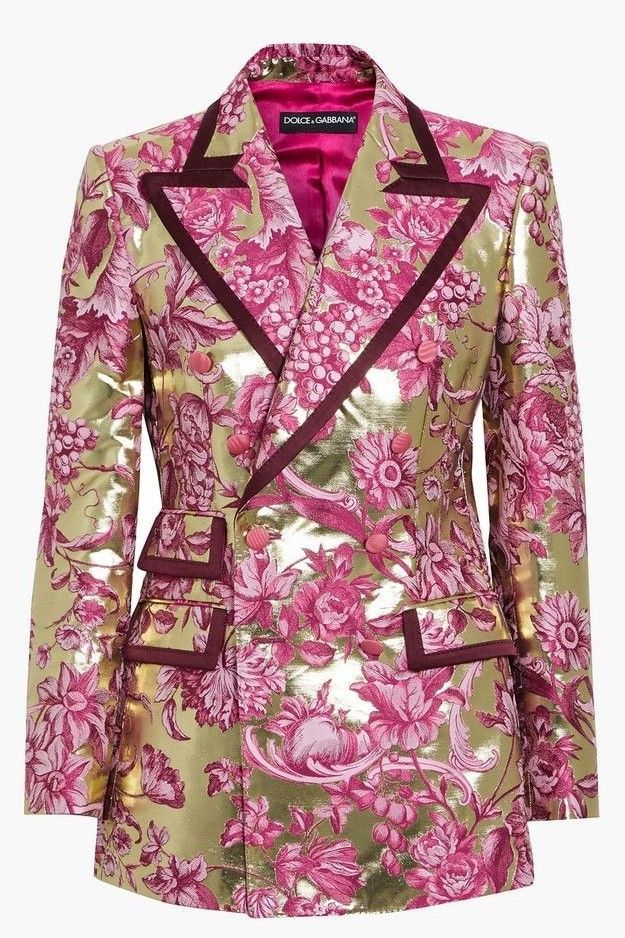 a doublebreasted blazer with a pink floral print on a gold background is shown. the blazer has a maroon trim on the collar, lapel, pockets, and button detailing. the lining is pink.