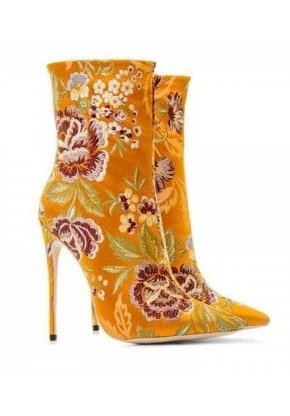 two floral pattern stiletto ankle boots, with one partially behind the other.