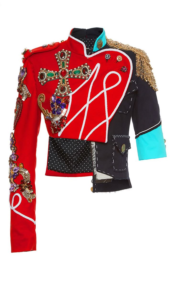a red and black militarystyle jacket is shown. the left side is red with heavy gold and colorful embellishments, including a cross design. white piping accentuates the red panel. the right side is predominantly black, with visible stitching and a turquoise panel on the sleeve. a section of black polka dot fabric connects the two sides. the jacket has a unique asymmetrical design.
