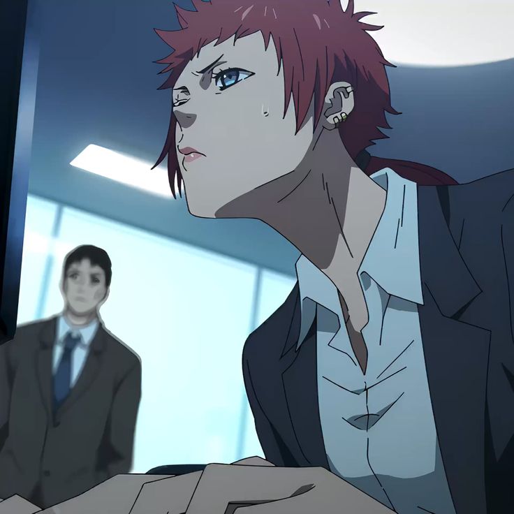 a woman with striking red hair, styled in a short, spiky cut, sits intently focused on a computer screen. she's dressed in a sharp business suit, the dark fabric contrasting against her pale skin.  her expression is serious, brow slightly furrowed as she works. in the background, another figure in a suit can be seen, but they remain out of focus, emphasizing the woman as the central subject. the setting appears to be an office, indicated by the sterile, modern architecture and cool, artificial lighting.