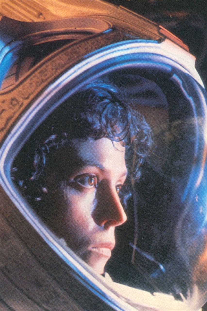 a closeup portrait of sigourney weaver as ellen ripley in the movie "alien." she is wearing a space suit and helmet and her expression is one of fear and apprehension. the image is dark and shadowy, creating a sense of unease and suspense.