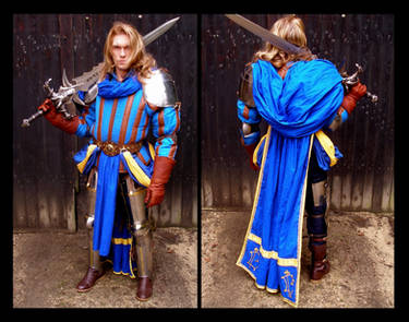 twoimage collage showing a male cosplayer in a detailed fantasy knight costume.  the costume is predominantly blue and gold, with metallic armor pieces and a flowing cape. he wields a large sword. the first image is a frontal view, while the second image shows the back of the cosplayer. the background is a wooden wall. the cosplayer is posed standing, and the lighting suggests an outdoor setting.
