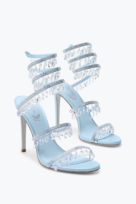 a pair of sky blue heeled sandals adorned with crystal straps and dangling crystal embellishments. the shoes have a delicate and elegant design perfect for a formal occasion.