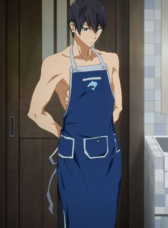 a shirtless, muscular, bluehaired anime character with blue eyes is shown from the thighs up, standing in a doorway. he has a contemplative expression on his face. he is wearing a blue apron with white trim and a small dolphin logo over his chest. the door behind him is brown with a silver vertical handle. the walls are white tile.