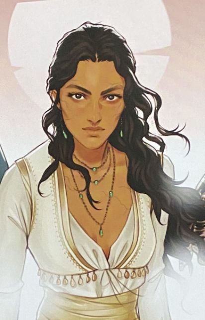 the image is a closeup illustration or drawing of a woman. she has long, dark wavy hair, olive skin, and is wearing a white and beige, intricately designed top. she has several necklaces and earrings, and a noticeable scar on her face. her expression is serious and determined. the style suggests fantasy art, possibly book cover art or character art from a novel or game. the background is softly blurred, suggesting a focus on the woman.