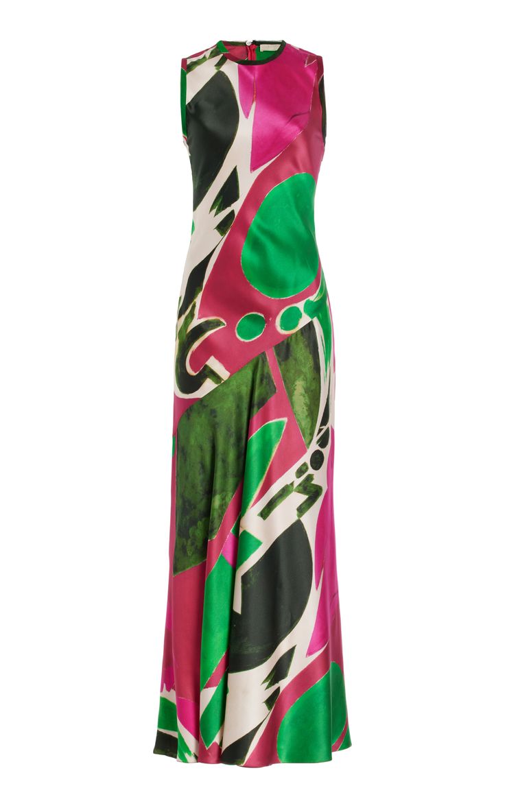 a woman's sleeveless silk maxi dress with an abstract geometric print in shades of green, pink, and white. the dress is photographed on a white background.
