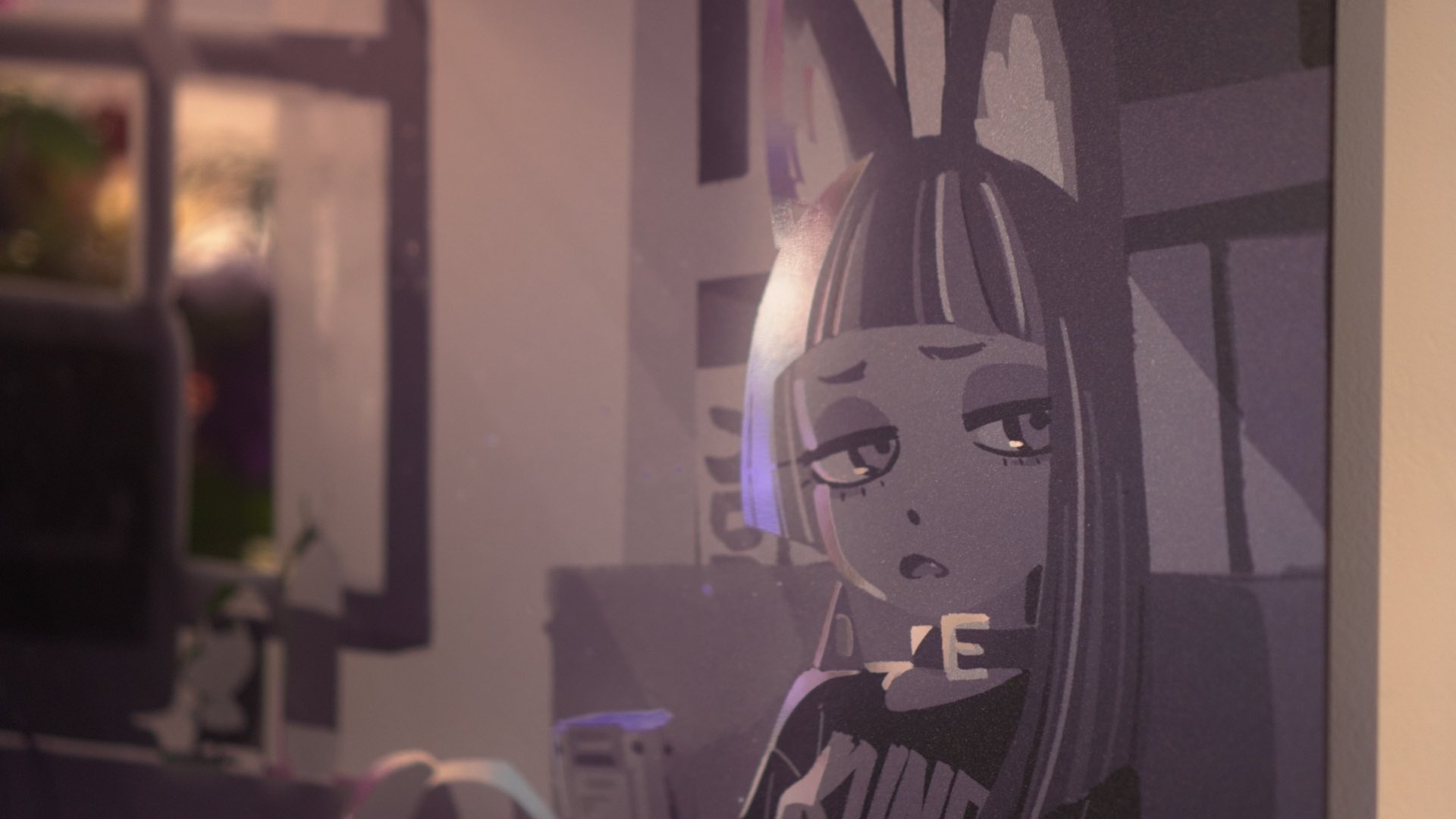 a closeup shot of a framed illustration of an egirl. the artwork has muted purple, grey, and pink tones, and depicts a young woman with cat ears and dyed hair, wearing a choker and graphic tshirt. she appears to be in a bedroom setting, with a computer monitor visible in the background.
