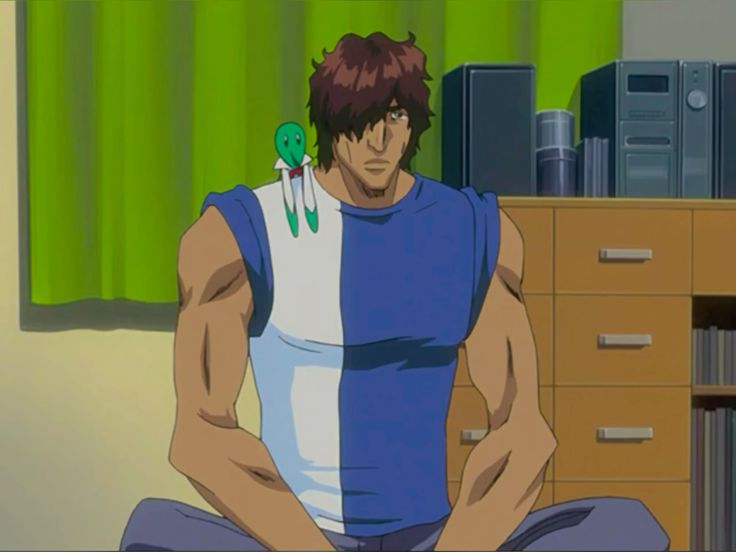 an anime character sitting down with a green alien doll on his shoulder, looking sad. he is in a bedroom with a dresser behind him.