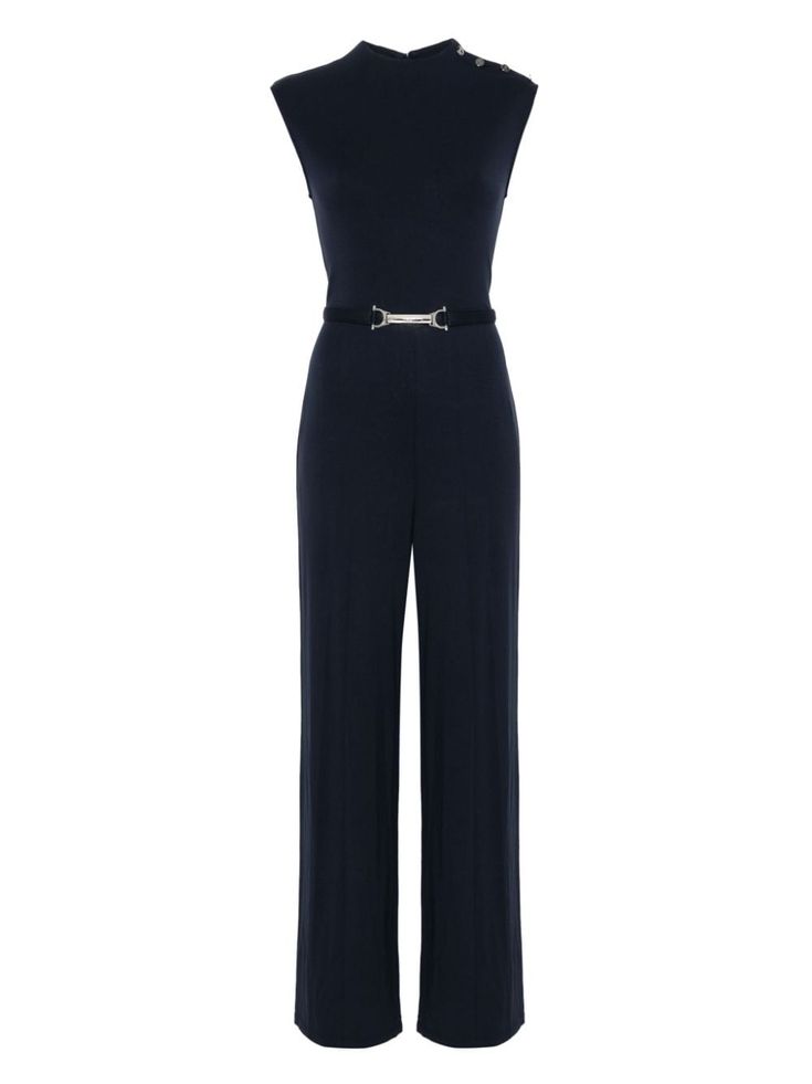 a navy blue sleeveless jumpsuit with a wide leg and a silver belt. the jumpsuit is a stylish and sophisticated piece of clothing. it would be perfect for a night out or a special occasion.