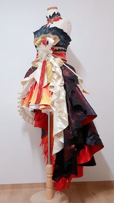 a captivating display of a meticulously crafted lolita fashion dress, showcasing a vibrant fusion of black, red, and gold hues. the dress, with its intricate lacework and elaborate ruffles, embodies elegance and artistry, reflecting the creativity and skill of its creator.