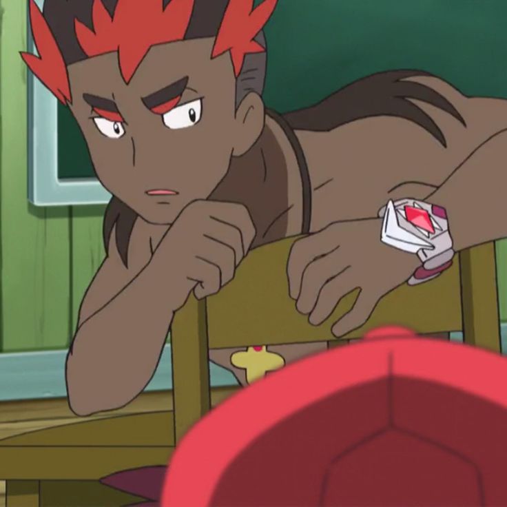 this image shows an anime character sitting in a wooden chair with his chin resting on his hand. he's looking at something in the background, possibly out of frame, and appears to be concerned. he has red hair and dark skin, he is wearing an orange shirt and necklace, and has a red cap on his head.