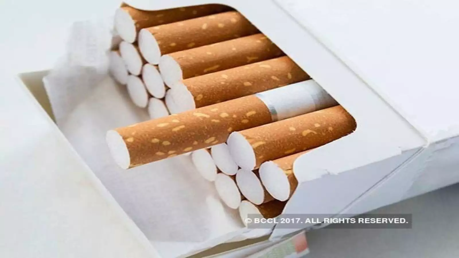 a partially opened pack of cigarettes with visible cigarettes.