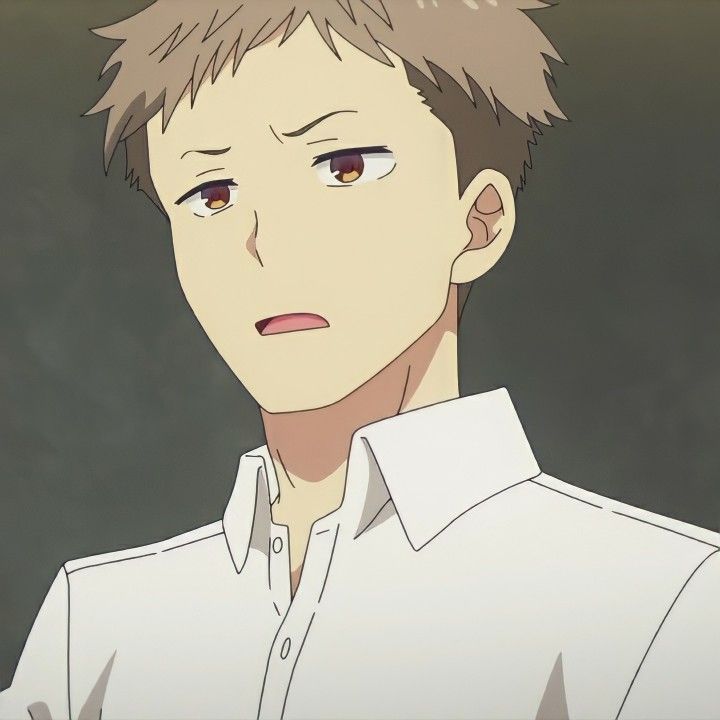 a closeup of a young anime boy with brown hair. he is wearing a white shirt with a collar and appears to be surprised or confused. his eyes are wide and his mouth is slightly open. his expression is one of bewilderment or shock. the background is a blurred light brown color.