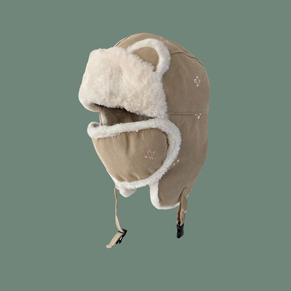 a brown winter trapper hat with fur ear flaps and a fur lining. the hat is made of a warm, cozy material and is perfect for keeping your head and ears warm in cold weather. the ear flaps are made of soft fur and can be tied up to the top of the hat. the fur lining is warm and comfortable and helps to insulate the head from the cold. the hat has a stylish and trendy design and is perfect for both men and women.