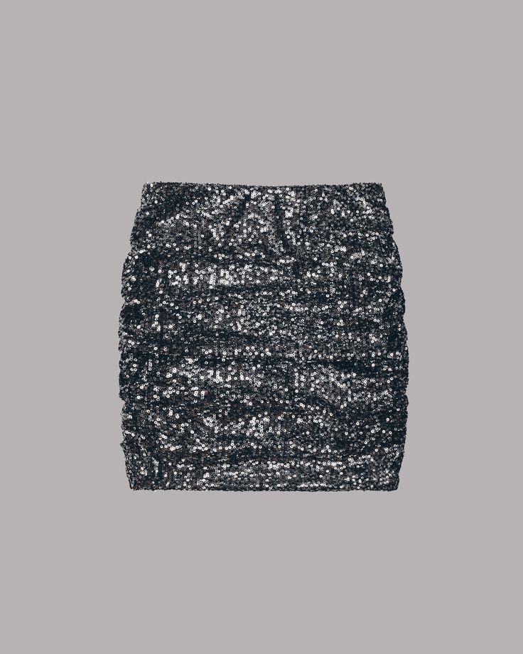 a black sequin skirt. the skirt is made of a stretchy material and has a high waist. it is a very sparkly and glamorous skirt that would be perfect for a night out.