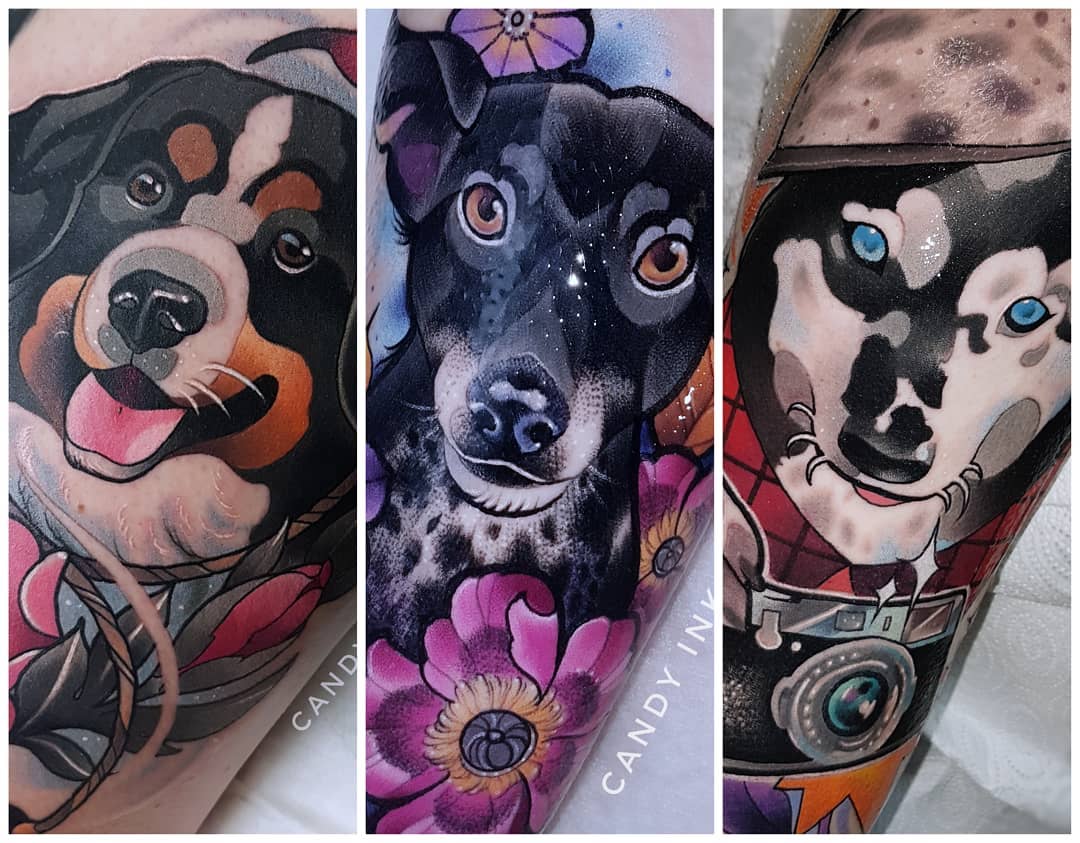 the image shows three different neo traditional style tattoos of dogs. the leftmost tattoo depicts a brown and black dog with a white chest and flowers. the middle tattoo is of a black and white dog with a floral background. the rightmost tattoo is of a husky dog wearing a red bandana and holding a camera. all tattoos are colorful and appear to be freshly done on arms.