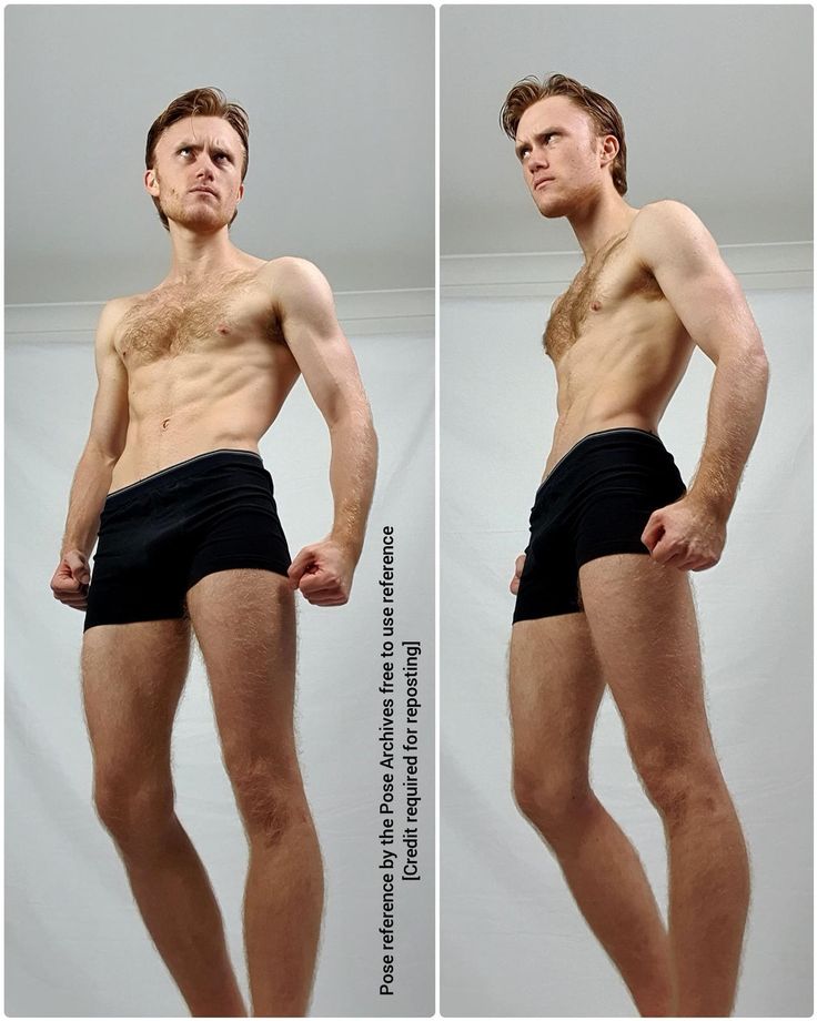 this is a photo of a muscular man standing in a studio against a white background. he is wearing black underwear and has his arms bent at the elbows. the image is a reference for artists and animators.