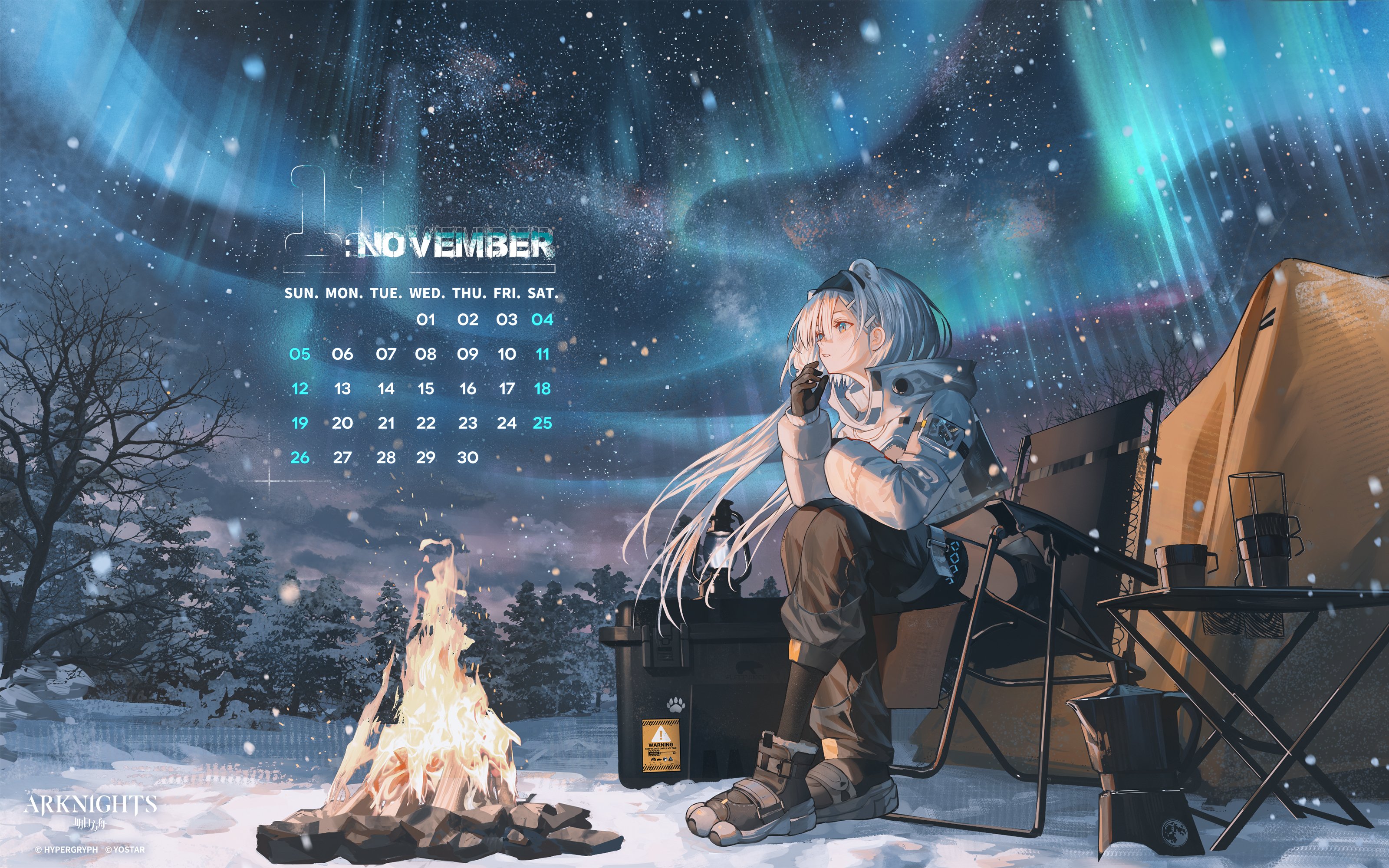 he image is a november 2024 calendar featuring artwork from the game arknights. it depicts an anime girl with long white hair, dressed in tactical winter gear, sitting in a camping chair by a campfire in a snowy landscape under an aurora borealis.  the calendar is prominently displayed, with the girl and the scene providing a visually appealing backdrop.  various camping equipment is also visible, adding to the winter camping theme. the art style is detailed and painterly.