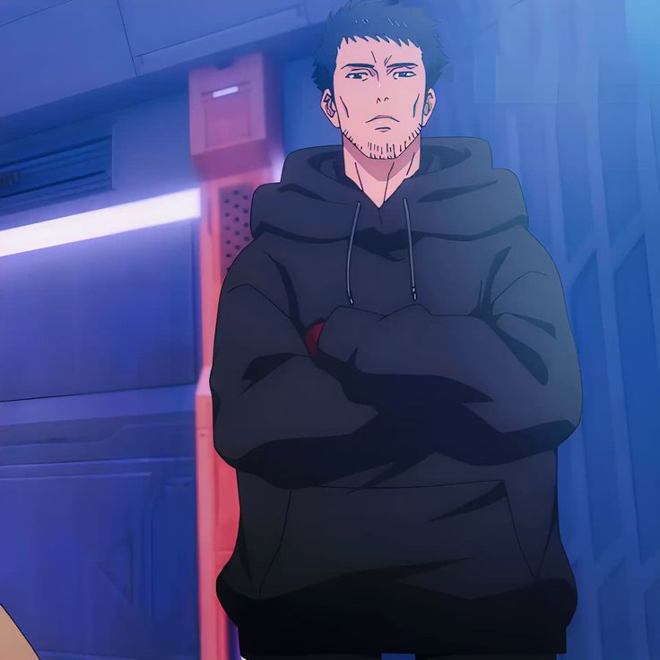 the image shows an anime character, a man with short black hair and stubble, standing in a futuristiclooking hallway. he has a serious expression and is wearing a black hoodie. the lighting is primarily blue, giving the scene a cool tone.