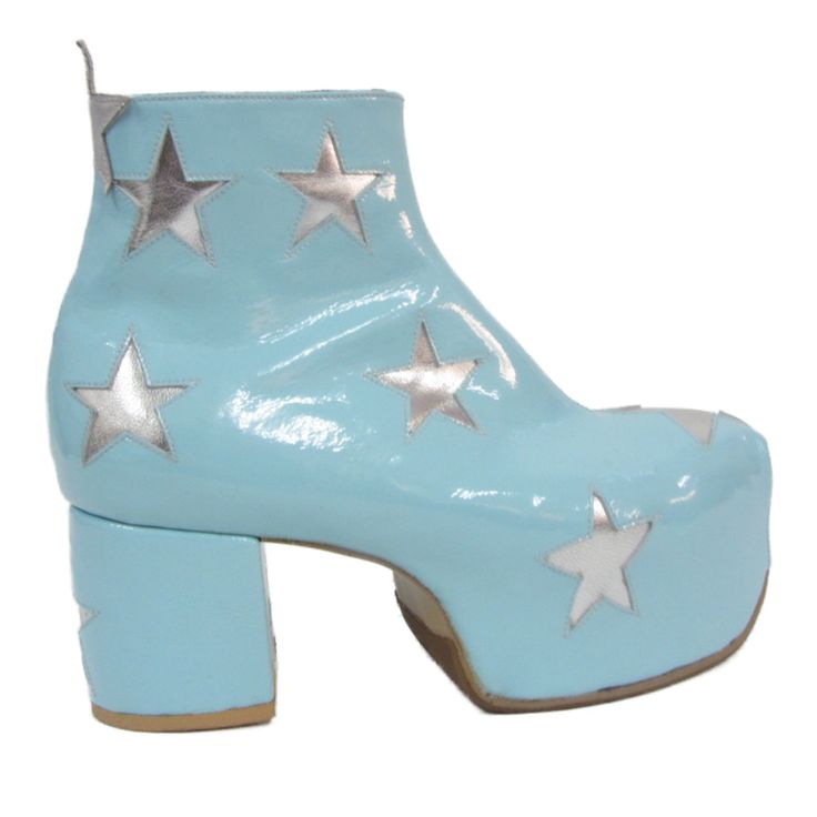 a single light blue patent leather ankle boot with a high heel and platform sole. the boot is decorated with silver stars.