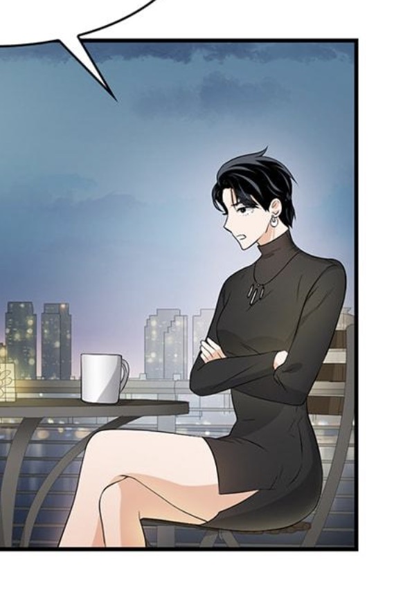the image shows a mangastyle illustration of a young woman sitting at a table on a balcony overlooking a city at night. she is wearing a black dress and has her arms crossed, appearing upset or annoyed.  a coffee cup sits on the table beside her. the background features a cityscape at dusk or dawn. the art style is clean and crisp with a focus on character expression.  the scene suggests a moment of contemplation or frustration.