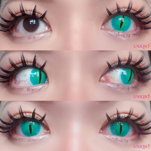 a closeup image of a woman wearing green colored contact lenses.  her eyes are framed by a dramatic eyelashes and bold brows. she has beautiful skin and a natural look.  her face is framed by black hair.