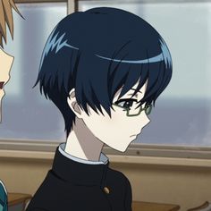the image showcases a side profile portrait of a young anime boy, likely a student, with short, dark blue hair and blue eyes. he wears a standard japanese school uniform with a dark blue jacket and a white collared shirt underneath. he has a pair of rectangular glasses perched on his nose. his expression appears serious or contemplative. the background suggests a classroom setting, with a window and a glimpse of what could be a wall. the lighting is soft, possibly natural light filtering through the window, casting subtle shadows on his face.