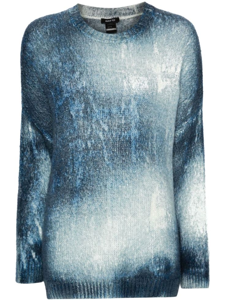 a blue and white ombre knit sweater for women with long sleeves. the sweater is made of a soft, cozy material and has a relaxed fit. it is perfect for layering in the fall or winter.