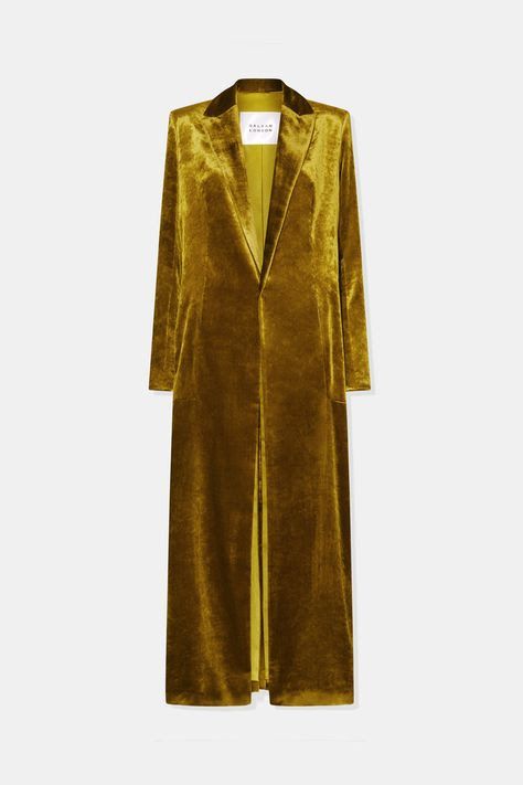 a long, gold velvet blazer for women. the blazer has a classic cut, long sleeves, and a notched collar. the blazer is fully lined and is made of a highquality velvet fabric. the blazer is perfect for fall or winter and can be dressed up or down.