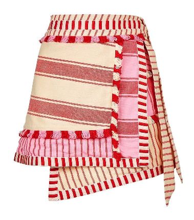 a wrap skirt with red and white stripes and pink stripes, featuring tassel trim and an asymmetrical hem.