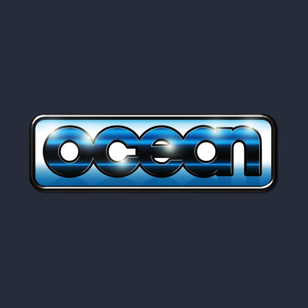 this is a blue and silver logo for the video game company, ocean software. it is a classic 80s style logo with a metallic look.  the word "ocean" is written in a bold, sansserif font with a  blue and silver color scheme. the letters are outlined in silver and appear to have a reflective, shiny surface. the logo is surrounded by a silver border.
