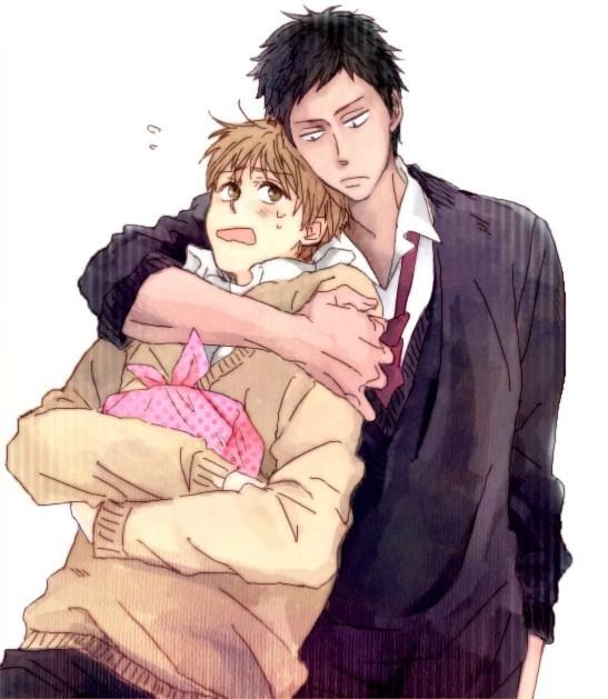the image is a piece of fanart depicting two animestyle boys in a close embrace.  the taller boy with dark brown/black hair in a slightly messy style wears a dark blazer and what looks like a school uniform shirt, partially visible underneath. he has a serious yet slightly soft expression. the shorter boy with light brown hair has a more surprised and flustered expression, his cheeks lightly blushed. he's wearing a beige sweater and is being held tightly by the taller boy. the shorter boy is clutching a pink wrapped gift to his chest. the style is soft and somewhat painterly, resembling a watercolor effect. the overall mood is romantic and intimate, suggestive of a close relationship between the two characters. the background is plain white, focusing attention on the figures.