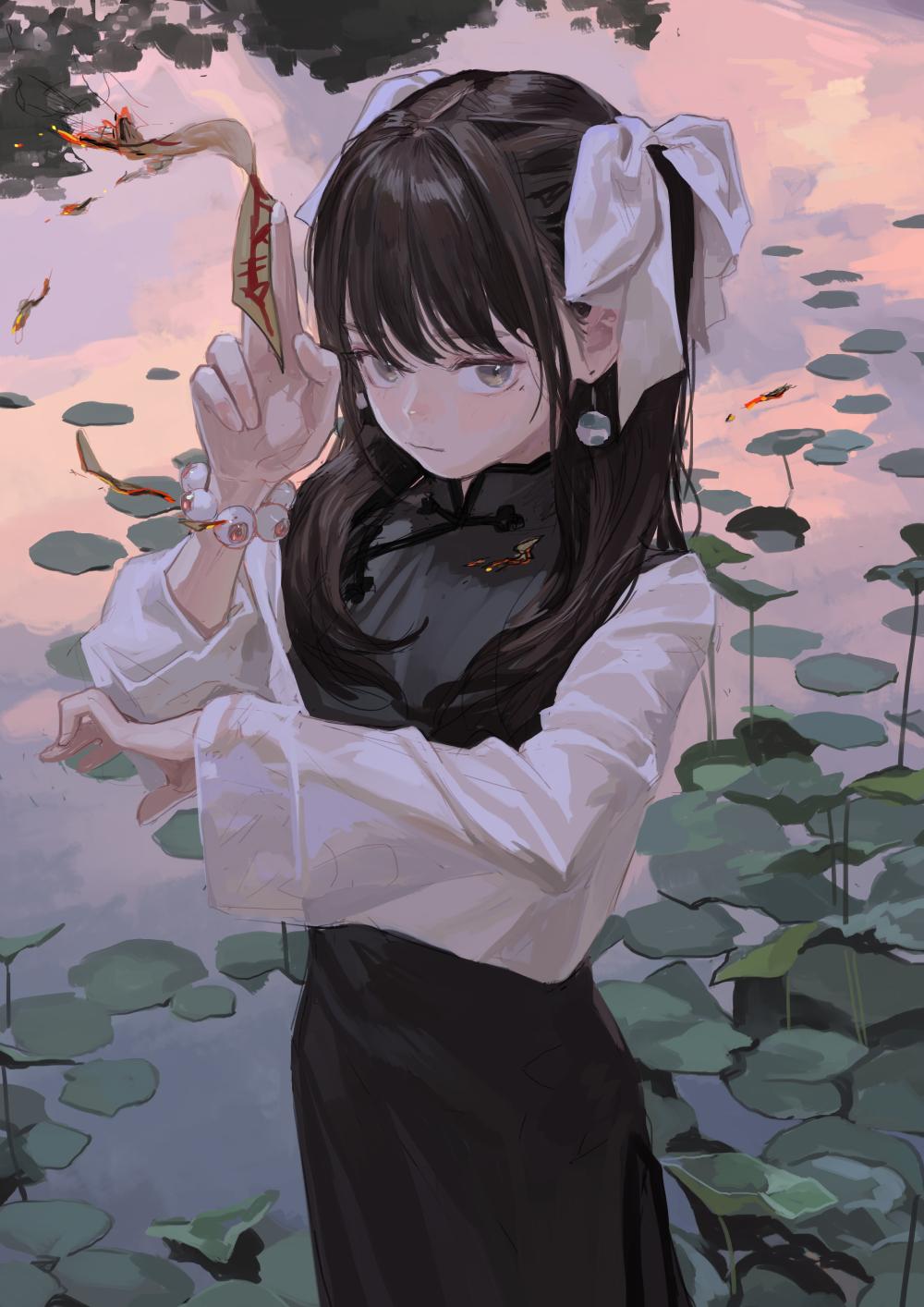 an animestyle girl with dark hair and fair skin stands in a serene pond filled with water lily pads under a pink sky. she is wearing a black traditional chinese dress over a white longsleeved shirt, with white ribbons in her hair. her hand holds a paper talisman, and she wears a bracelet with eyelike beads. she looks elegant and contemplative.