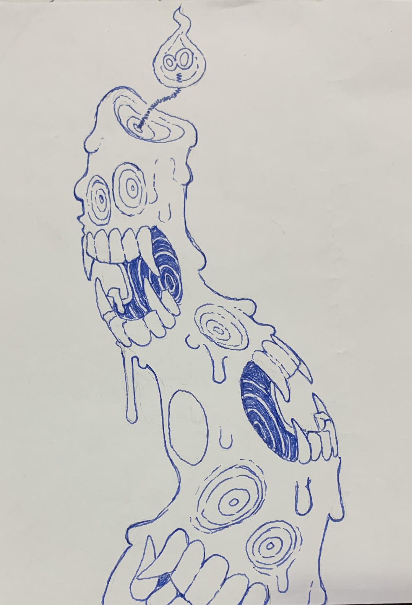 this is a blue pen drawing on white paper of a melting candle that resembles a monster. the candle has melting wax dripping down that has eyes and teeth drawn on it. the candle's flame has a face drawn on it as well.