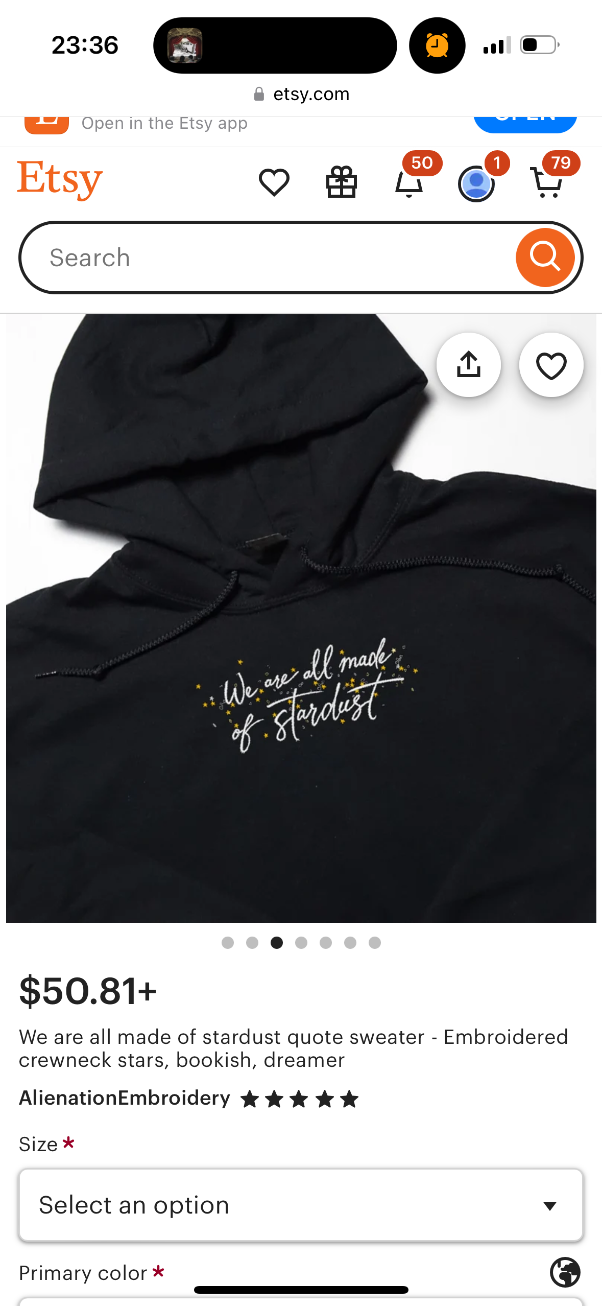 a black hoodie with the words "we are all made of stardust" embroidered on it. the text is in white with a small, glittery effect. the product description states that it is a crewneck style sweatshirt for adults.