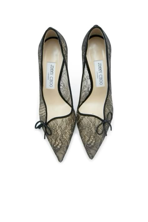 a pair of black lace jimmy choo heels, with pointed toes and a delicate bow on the front. the shoes are elegant and stylish, perfect for a special occasion.