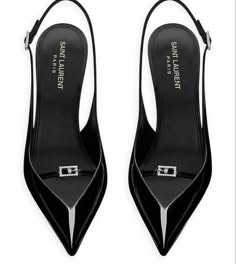 a pair of black leather saint laurent stiletto pumps with pointy toes. the heels are high and the shoes are elegant and chic. they would be perfect for a formal occasion or a night out.  the shoes have a simple design with a silver buckle on the strap.