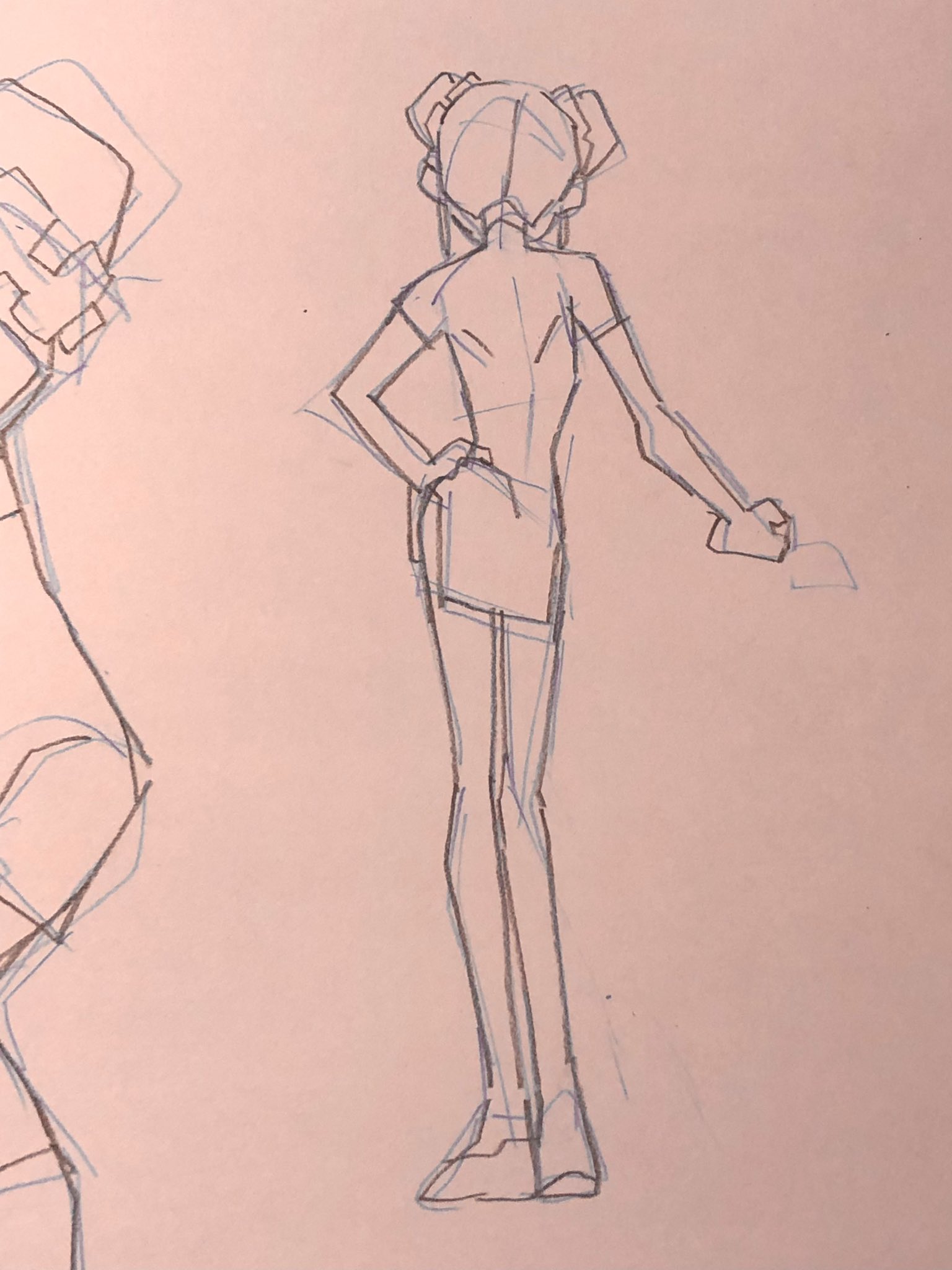 a quick sketch of a female figure from the back, drawn in pencil on pink toned paper.  the artist seems to be focusing on gesture and pose, with minimal detail. there is a partial figure sketch to the left.