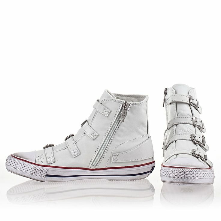 a pair of white leather high top sneakers with buckles and a zip closure. the sneakers have a white rubber sole with a red and blue stripe around the edge. the sneakers are shown on a white background.