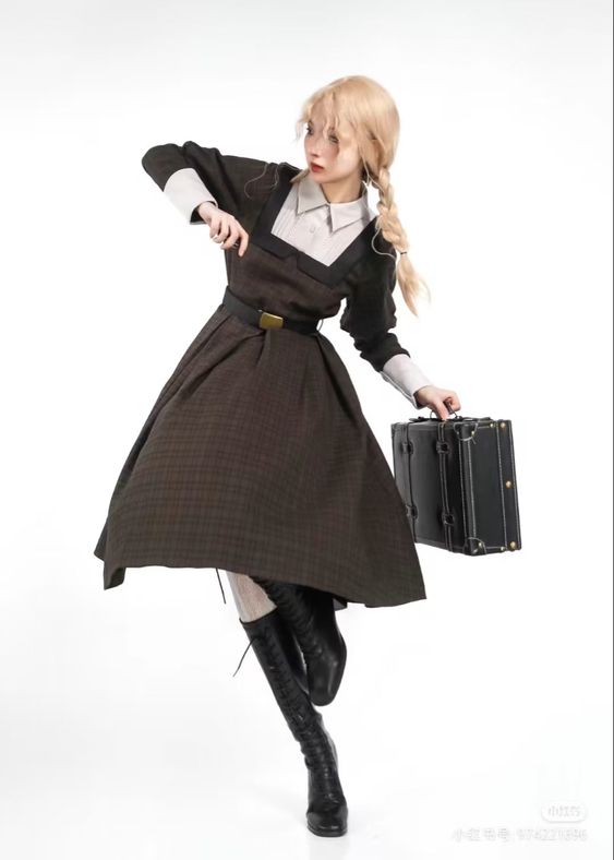 a woman with long blonde hair, styled in braids, poses against a white background. she wears a vintageinspired brown checkered dress with a white collar and cuffs, accented by a black belt. she's wearing black lacedup high heel boots and is holding a black briefcase in her left hand. her pose is dynamic, with one leg extended and her body turned away from the camera, creating a sense of movement and elegance.