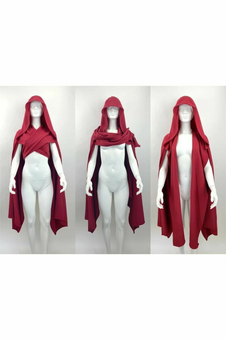 three mannequins wearing variations of a maroon hooded cape. the leftmost mannequin is wearing the cape crossed over the chest, the middle mannequin has it draped around the neck like a scarf, and the rightmost mannequin wears it as a standard cape.