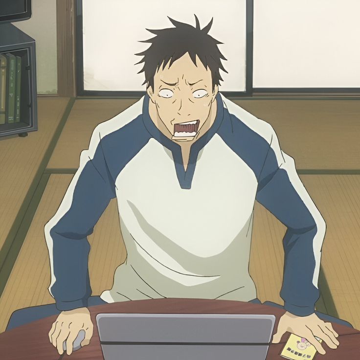 a cartoon man with a shocked expression on his face is sitting on the floor in front of a laptop. he is wearing a blue and white shirt. the image appears to be a screenshot or still from an anime or manga.