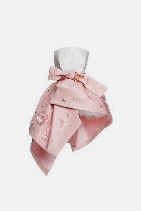 a strapless dress is shown in the image. the top portion of the dress is white, and the bottom portion is pink with floral embellishments and a bow.