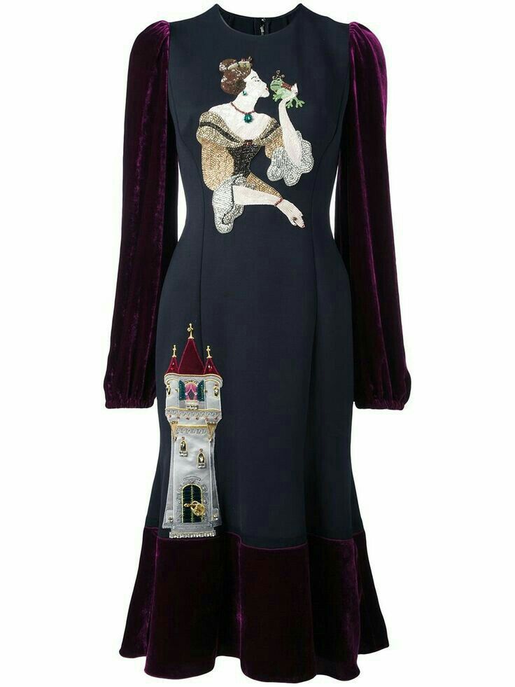 a midilength dress with a mermaid silhouette. the dress is navy blue with long, puffy velvet sleeves in a dark purple hue. the lower hem also features the same purple velvet. a large embroidery of a woman kissing a frog is on the upper part of the dress. a towershaped embellishment is on the lower left side.