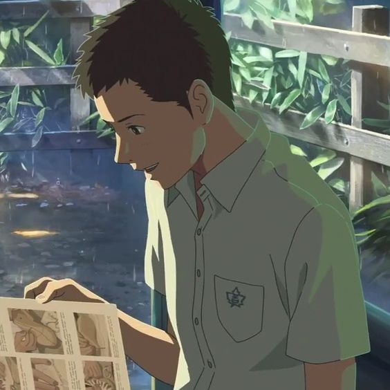 an anime illustration of a young man sitting and looking at a book. he is wearing a white shortsleeve shirt with a small emblem. his hair is short and black, and he has a smile on his face. the background suggests that he is outdoors and it is raining. the scene takes place at a bus stop, as indicated by the bench he's sitting on.  the color palette and art style are reminiscent of work by studio ghibli.