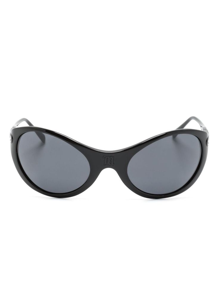 a pair of black sunglasses with a rounded, oval frame. the frame is made of a thick, plastic material and the lenses are dark. the sunglasses are isolated on a white background.