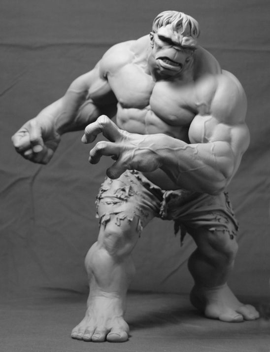 the image showcases a meticulously sculpted grayscale statue of the hulk, a renowned marvel comics character.  the hulk stands in a dynamic pose, muscles tensed, with a fierce expression on his face. he is captured from a slightly low angle, emphasizing his imposing physique. the background is a neutral gray, drawing focus solely to the sculpture. the studio lighting highlights the details of the hulk's anatomy and the texture of the sculpting material.