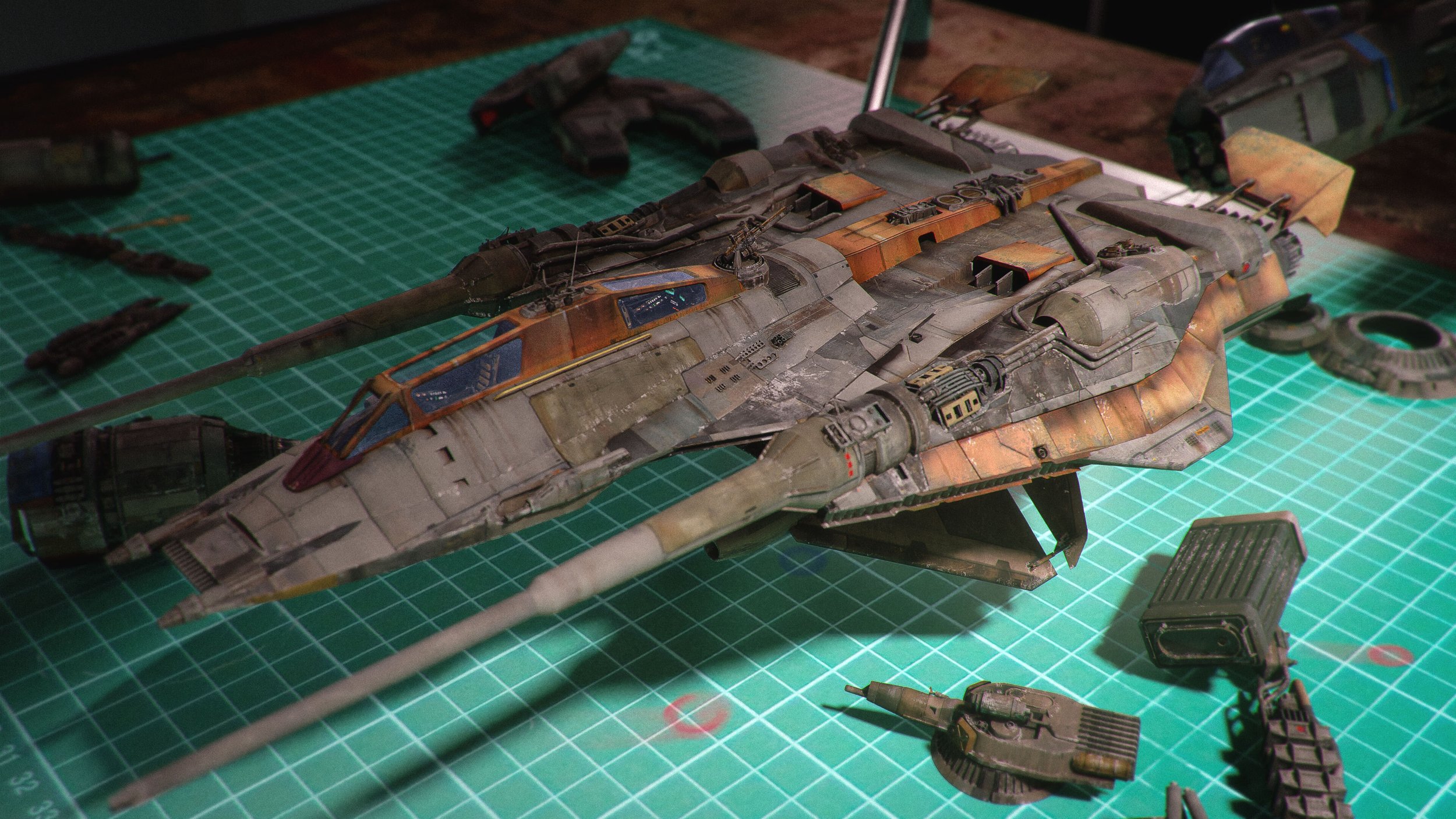 a closeup shot of a meticulously detailed model kit of a spaceship, possibly from a science fiction universe. the model is predominantly grey and brown, with weathering effects that give it a worn and battlescarred appearance.  it's resting on a green cutting mat, surrounded by various small parts and components, suggesting it's still under construction or recently completed. the setting appears to be a hobbyist's workbench, with other model parts visible in the background.  the focus is sharp on the spaceship, allowing for a clear view of the intricate details. the overall mood is one of careful craftsmanship and attention to detail.