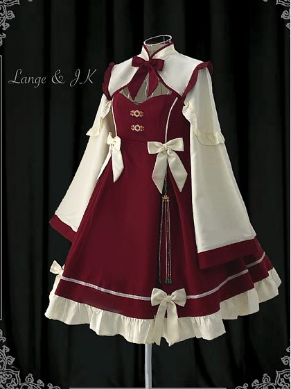 a mannequin displays a burgundy and cream lolita fashion dress with chinese influences in the style.  the dress has a high, mandarin collar, long, bellshaped sleeves with flared cuffs, and a flowing skirt with layers of ruffles and lace.  a decorative tassel hangs from the waist.