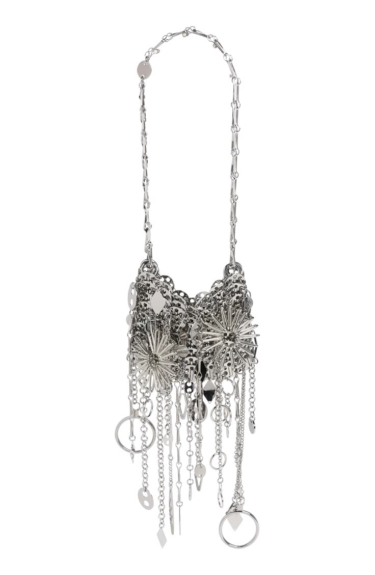 a silver chain necklace with a dangling, intricate pendant of silver rings, chains, and charms.
